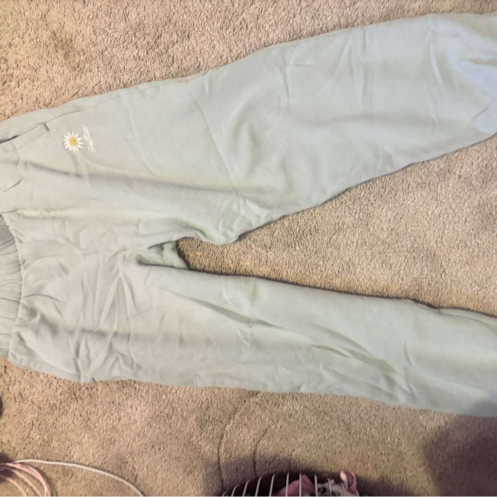 Green hollister sweatpants joggers with design